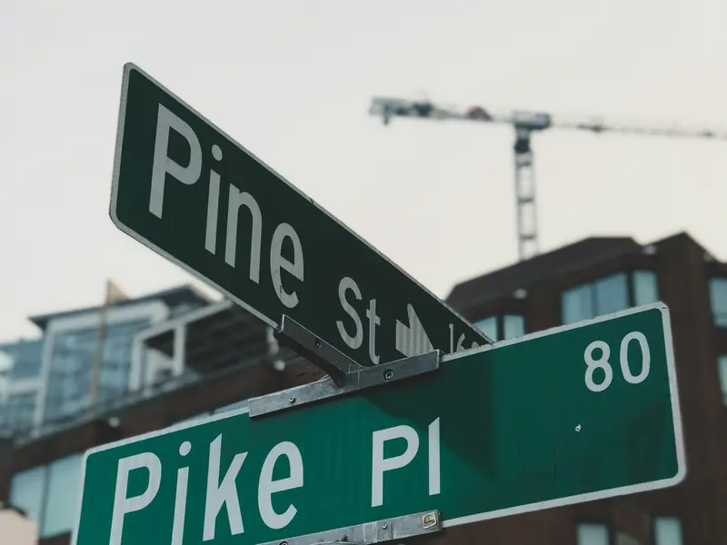 Stock photo: green retroreflective street name signs mounted on a metal pole